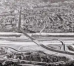 Aerial view of recently constructed Golden State Freeway (I-5) with Atwater Village in the background, separated by the Los Angeles River (1957)