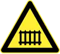 Railroad ahead (with safety barriers)