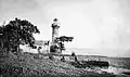 Fort Rotterdam lighthouse and Lannea grandis and Terminalia edulis trees (left and right respectively)