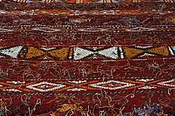 Berber woolen tapestry with woven motifs