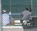 Detainees sit around the exercise yard in Camp 4, the medium security facility within Camp Delta at Naval Station Guantanamo Bay, Cuba.