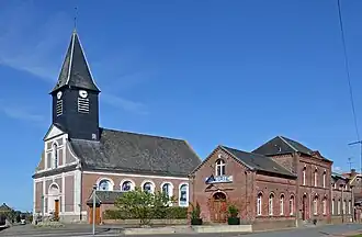 The church and town hall in Candas