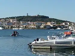 Houses on Ile St-Martin below buildings on Mont St-Martin and the green Mont St-Loup on the right