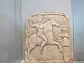 Thracian rider of "Scythian" type, with raised hand, riding towards female figure, Madara Museum, Bulgaria