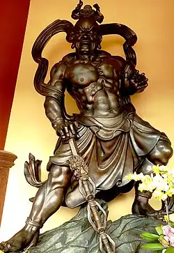 Two out of eight Bát bộ kim cang statues at Phật Cô Đơn temple