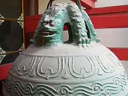 A bell in Chang Chun Temple, Wuhan, hanging on its pulao