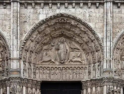 Central tympanum of the Royal Portal. Christ seated on a throne, surrounded by the symbols of the Evangelists; a winged man for St. Matthew, a lion for St. Mark; a bull for St. Luke; and an eagle for St. John.