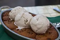 A cookie dessert, topped with ice cream