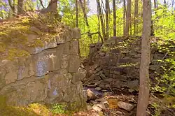 The now damaged granite block eastern and western abutments that were part of the Falling Creek Railroad Bridge of the Chesterfield Railroad.
