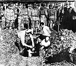 Prisoners being buried alive[124]
