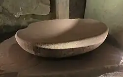 A chiselled granite basin in the east side-chamber