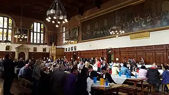 Pupils in the dining hall, with the Verrio painting in the background