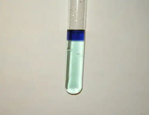 "chromium(VI) oxide peroxide" in ether phase (above) and chromium(III) aqueous solution (below).