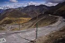Winding mountain road, with messages painted on the pavement