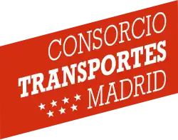 A red parallelogram slanted so that the right side is slightly higher than the left and with the fully-capitalized text "CONSORCIO TRANSPORTES MADRID" written in flush right serif font, each word on a separate line, and slanted with the parallelogram. The word "TRANSPORTES" is bolded and there are 7 small stars to the left of the word "MADRID", aligned into two rows of 4 and 3 stars each respectively.