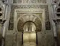 Mihrab of the Great Mosque of Córdoba (10th century), with horseshoe arch opening surrounded by a rectangular alfiz