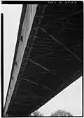 (image 7 of 9) 1984 Underside showing – from the bottom up – the lower lateral braces attached to the floor joists that support the floor planks.