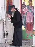 Monk working in the church