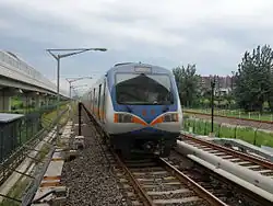Most Beijing Subway rolling stock, such as this DKZ5 Line 13 train, run on 1,435 millimetres (56.5 in) standard gauge track, drawing 750V direct current (DC) electrical power from the third rail. Line 13, like most lines, use six-car Type-B train sets.