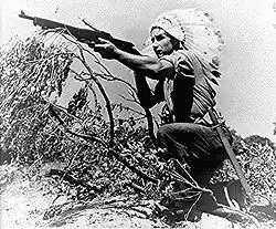 Dan Waupoose, a Menominee chief, training at Algiers, Louisiana, on August 24, 1943.