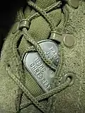ID tag (shown in boot), modern, designation: Christian