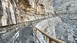 Very steep and rocky path, partly stepped with stone. Some sections are protected with safety railings. Wadi Litibah.