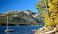 Boat's mast pointed at reddish Mount Judah. Donner Peak centered, from Donner Lake