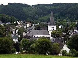 View of Drolshagen towards south from Papenberg (417&nbsp;m). St. Clement's Church dominates the skyline.