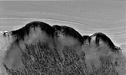 North Polar scarp in Abalos Undae with basal exposure and dunes