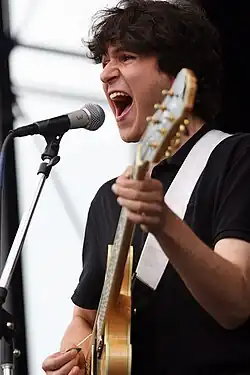 Ezra singing and playing guitar at Pitchfork Festival 2008