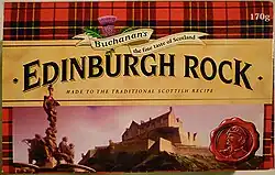 A box with a red tartan background, and image of Edinburgh Castle and in large letters across the middle, "Edinburgh Rock".
