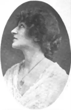 A white woman photographed in profile, in an oval frame