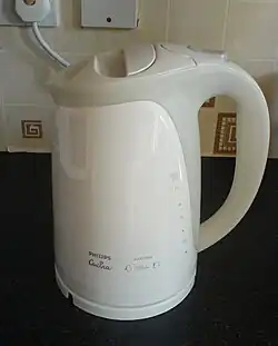 A contemporary &quot;jug&quot;‑style electric kettle made from enameled metal and plastic