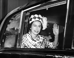 Elizabeth waving from a car