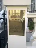 Plaque outside the embassy in English and Uzbek