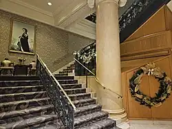 Hotel entrance stairs with Queen Elizabeth II portrait