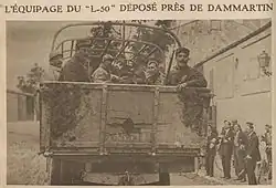 newspaper clipping of men in the back of a truck