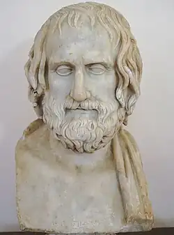 stone bust of a bearded man