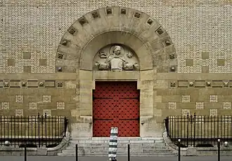 Portal of the church with sculpture of Saint Dominique