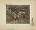 Jinriki, 1886. Hand-coloured albumen print on a decorated album page. A rickshaw driver, two passengers and a bearer.