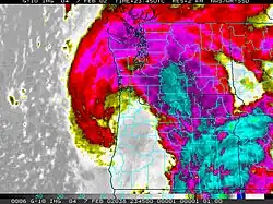 Infrared satellite image of the Oregon, Washington, and western Idaho, with the state borders shown in black lines and counties in blue lines. The South Valley Surprise is visible as a claw-shaped cloud formation over the three states.