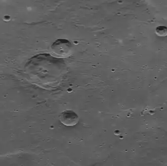 Oblique view of Fet crater (upper left) in Tir Planitia, showing the nature of the smooth plain