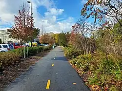 A rail trail in a suburban area