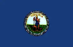 The Virginia flag from the 1930s before standardization of the seal; it depicts Virtus and tyranny on a grassy field.