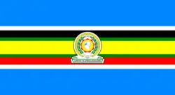 Nine horizontal strips coloured (from top to bottom): blue, white, black, green, yellow, green, red, white, then blue. The emblem of the EAC is placed in the centre.