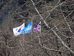 Flags flying by Gloster Memorial by Seolmacheon