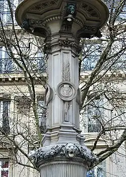 Neoclassical fleuron on the capital of a Corinthian pilaster of the Fontaines du Théâtre-Français, Paris, designed by Gabriel Davioud and sculpted by François Théophile Murgey,[4] 1867-1874