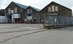 The former railway works buildings.