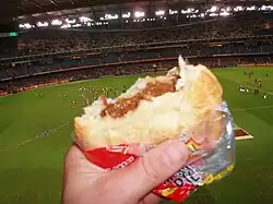 Meat pie at a football match