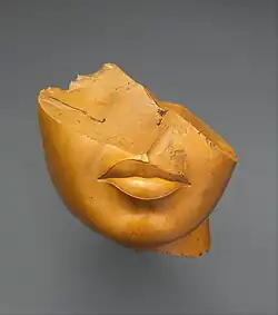 Fragment of a queen's face; 1353–1336 BC; yellow jasper; height: 13 cm, width: 12.5 cm, depth: 12.5 cm; Metropolitan Museum of Art